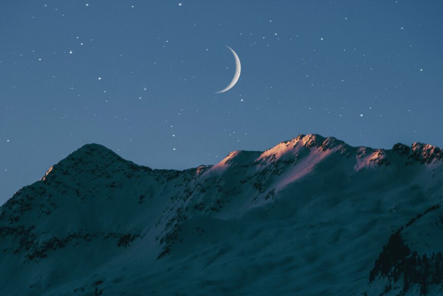 New Moon in the Night Sky over the Mountain Line