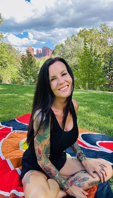 Kelli Dewett sitting in grass