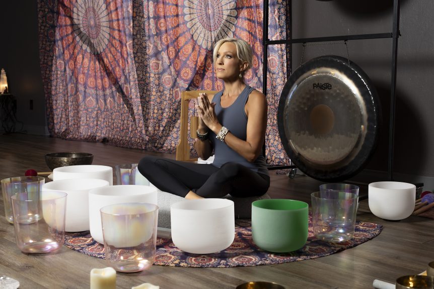 Picture of Cary surrounded by sound bowls